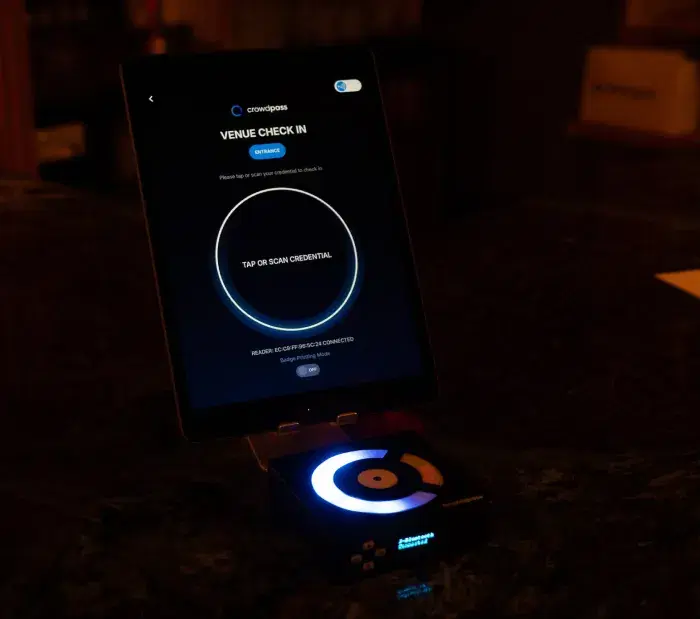 CrowdReader device close-up showing LED display and scanning surface